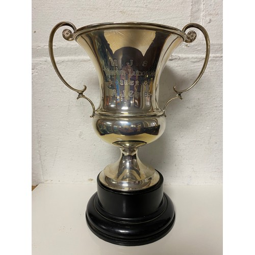 17 - A George V silver trophy cup, London 1914, twin handled and with presentation inscription -