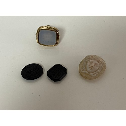 33 - A 19th century fob seal, inset with hardstone seal engraved with initials, together with a hardstone... 