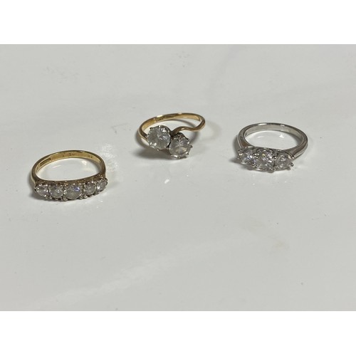 43 - A 9ct gold ring, set with two CZ in a crossover design, two other CZ set rings and a quantity of cos... 