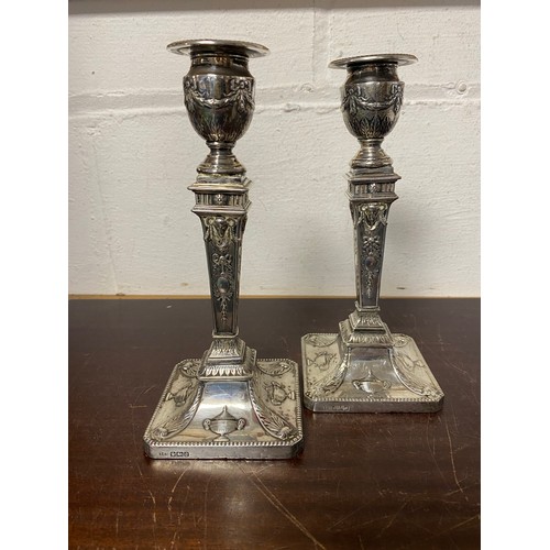 49 - A pair of neo-classical style silver candlesticks, Sheffield 1906 -