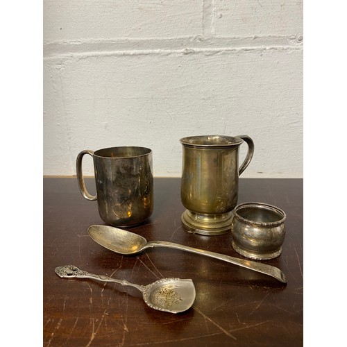 60 - A silver christening mug, Sheffield 1954, together with a silver napkin ring and spoon, an 800 stand... 