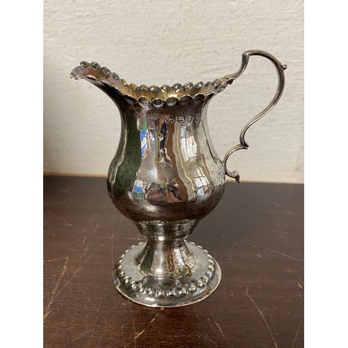 63 - A silver jug, London 1774, with gilt interior -