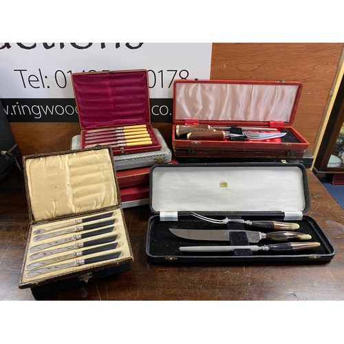 80 - A quantity of cased silver plated and horn carvery sets, steak knives and other cutlery -