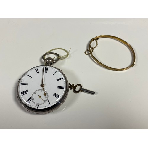 88 - A silver cased open face pocket watch and key and a metal core and gold bangle -