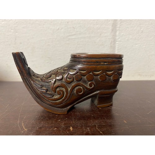 96 - A 19th century carved wooden snuff boot, with carved decoration -