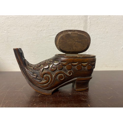 96 - A 19th century carved wooden snuff boot, with carved decoration -