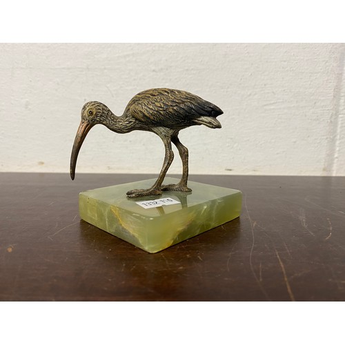 97 - A cold painted bronze of a kiwi, mounted on onyx base -