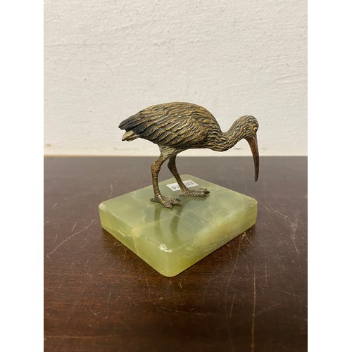 97 - A cold painted bronze of a kiwi, mounted on onyx base -