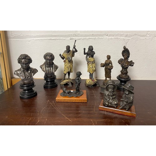 101 - A group of eight decorative figures, to include a pair of painted spelter musicians/dancers, a pair ... 