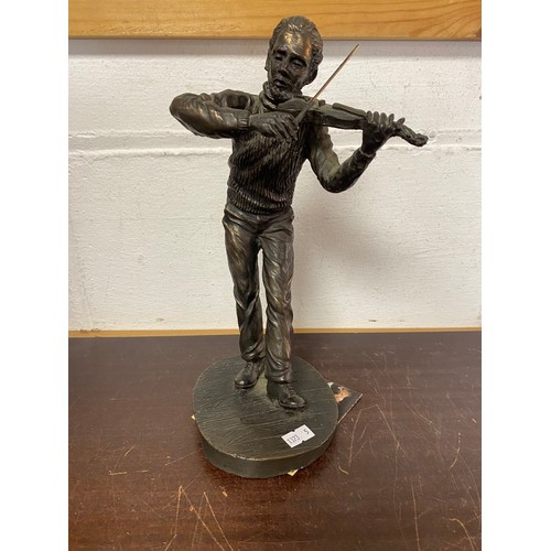 105 - A bronze finish model of a violinist -