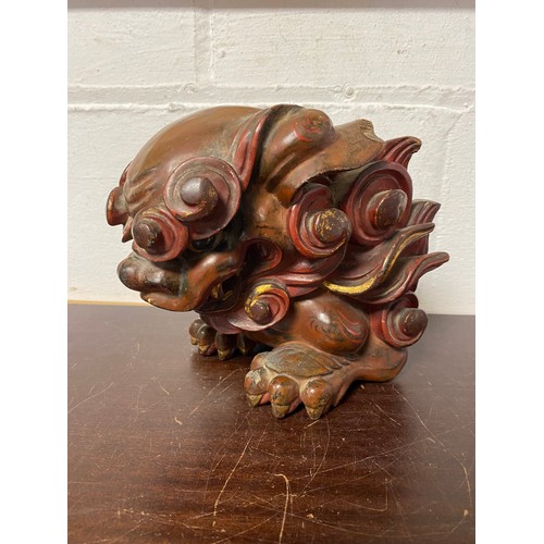 109 - A Chinese carved and paired model temple lion -