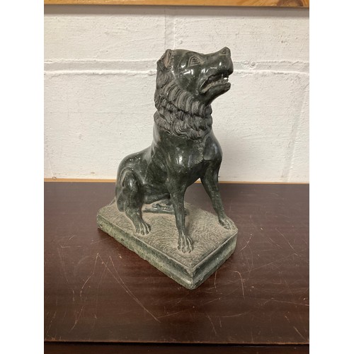 111 - A carved serpentine seated dog (a/f) -