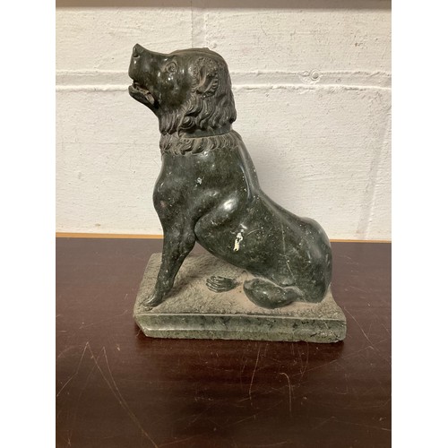 111 - A carved serpentine seated dog (a/f) -