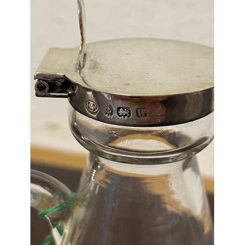 38 - A George V silver mounted noggin Hukin & Heath, Birmingham 1921, with hinged cover and star cut base... 