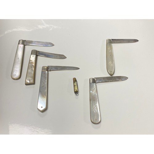 44 - A group of six mother of pearl handled folding fruit knives with a silver blade -