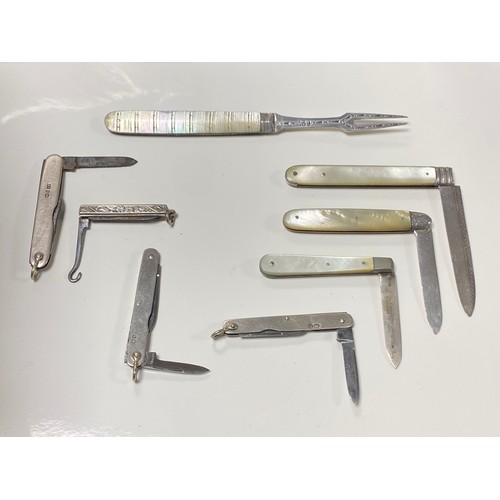 45 - A group of eight mother of pearl and silver mounted fruit knives, pocket knives and folding forks an... 