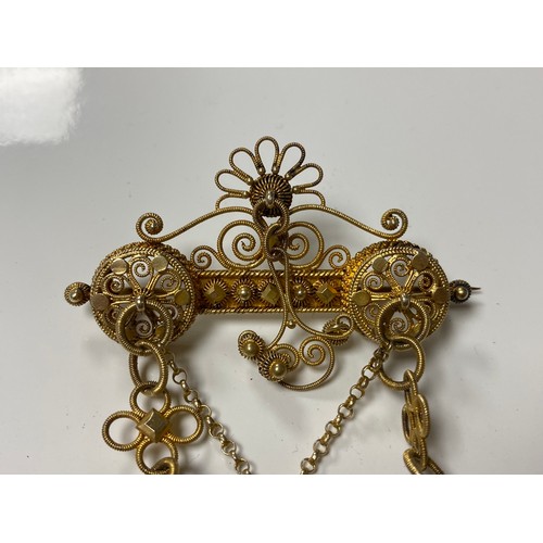 47 - An Scandinavian silver solje, 830 standard, the bar in filigree and with roundel decoration suspendi... 