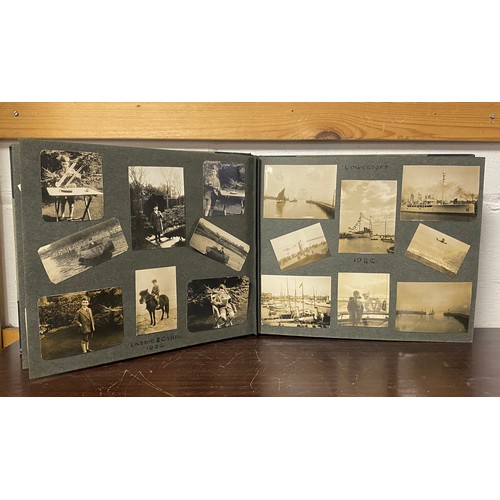 202 - A 1920s photograph album, including titled and annotated views including Dorset , Stonehenge, Snowdo... 