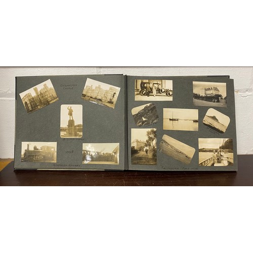 202 - A 1920s photograph album, including titled and annotated views including Dorset , Stonehenge, Snowdo... 