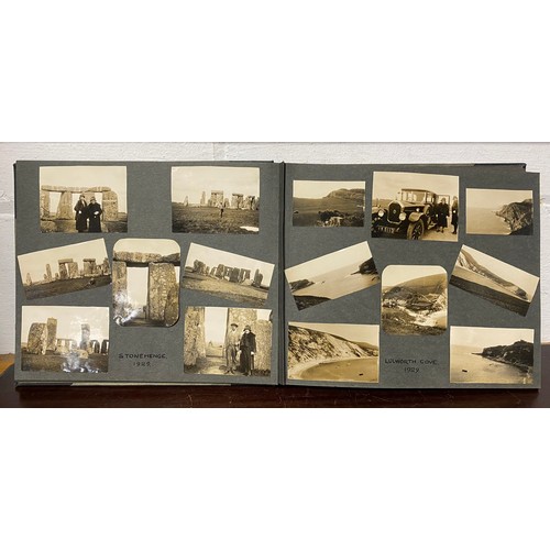 202 - A 1920s photograph album, including titled and annotated views including Dorset , Stonehenge, Snowdo... 