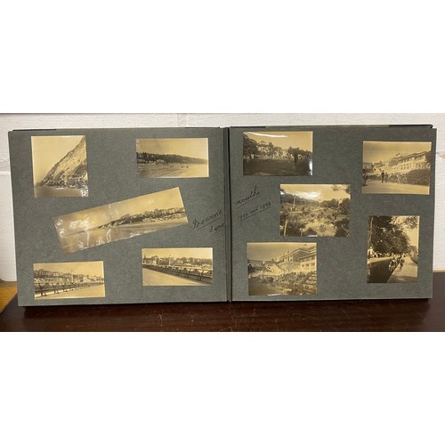 202 - A 1920s photograph album, including titled and annotated views including Dorset , Stonehenge, Snowdo... 