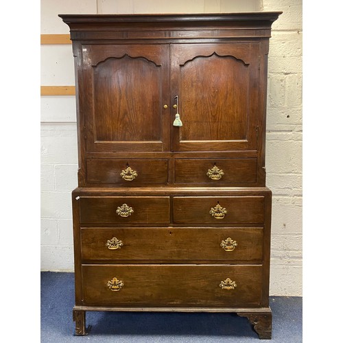 333 - An 18th century oak cupboard on chest, the top with two panelled doors over two drawers, the base fi... 