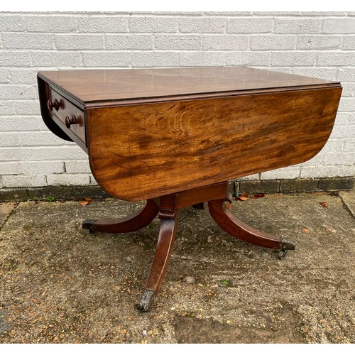 334 - A 19th century mahogany drop leaf dining table with two end drawers, centre pillar and four outswept... 