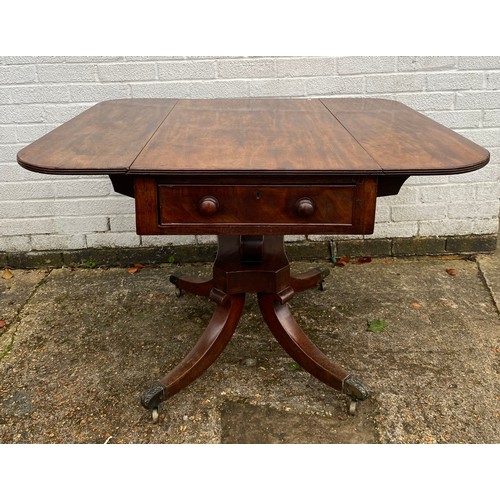 334 - A 19th century mahogany drop leaf dining table with two end drawers, centre pillar and four outswept... 