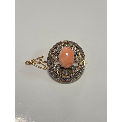 5 - A 19th century coral and diamond brooch centred with an oval coral cabochon in a surround of rose cu... 