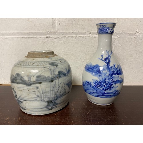 116 - A blue and white bottle vase/sake bottle, painted with a landscape, together with a provincial Chine... 