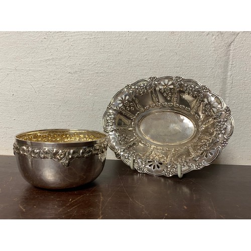 25 - A late Victorian silver bon bon dish, Sheffield 1897, with pierced and 'C' scroll rim, together with... 