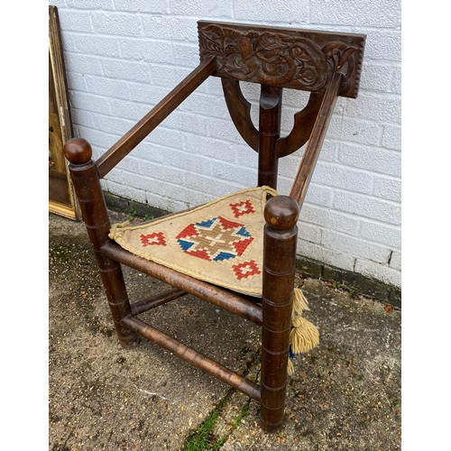 363 - A 19th Century carved oak Warwick/turners chair, with carved back, triangular seat and circular supp... 