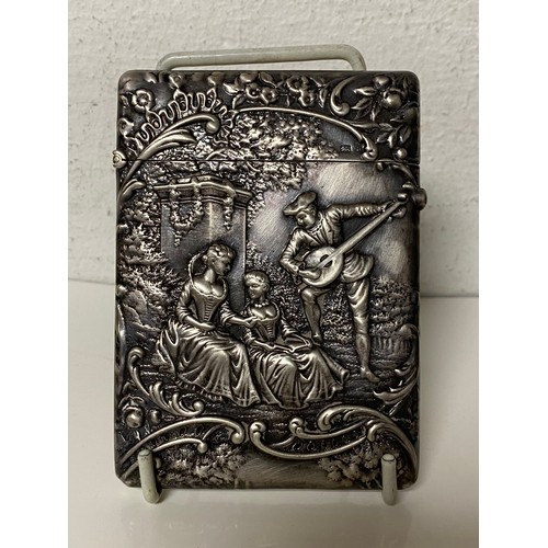 38 - An Edwardian silver card case, Birmingham 1901, decorated with figures in a terraced garden -