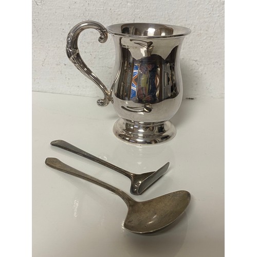 45 - A Queen Elizabeth II silver christening mug, Birmingham 1989, together with a pusher and a spoon, di... 