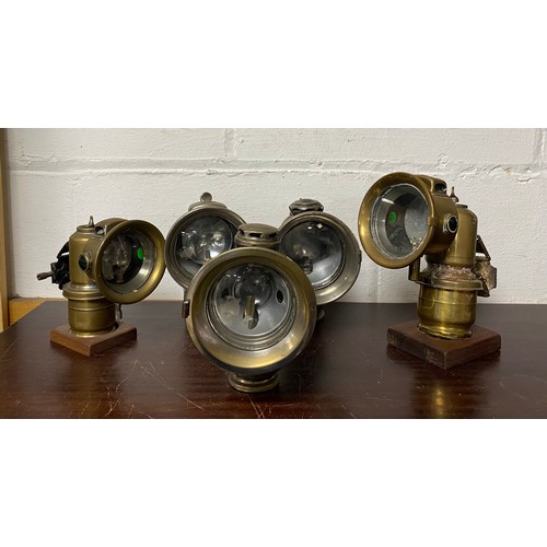 450 - A group of five lamps, including Lucas -