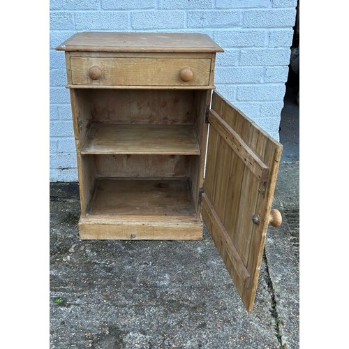 376 - A pine cupboard with single drawer over cupboard door -