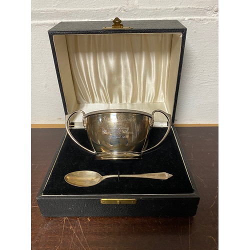 54 - A George V silver porringer, Birmingham 1932, cased with associated silver spoon -