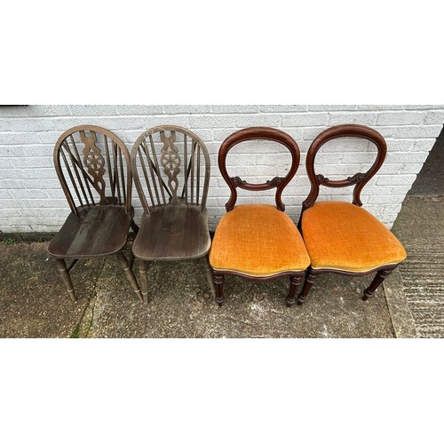 379 - A pair of Victorian balloon back chairs together with a pair of wheelback chairs -