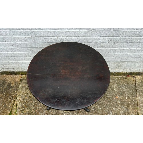 380 - A 19th Century snap top table, with circular top on a central column  -