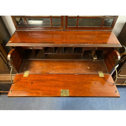 392 - A 19th Century mahogany and inlaid secretaire bookcase, the glazed top over secretaire drawer and cu... 