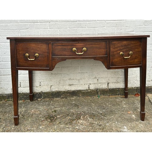 396 - A Georgian style bow fronted mahogany sideboard, fitted with three drawers, on tapering legs and spa... 