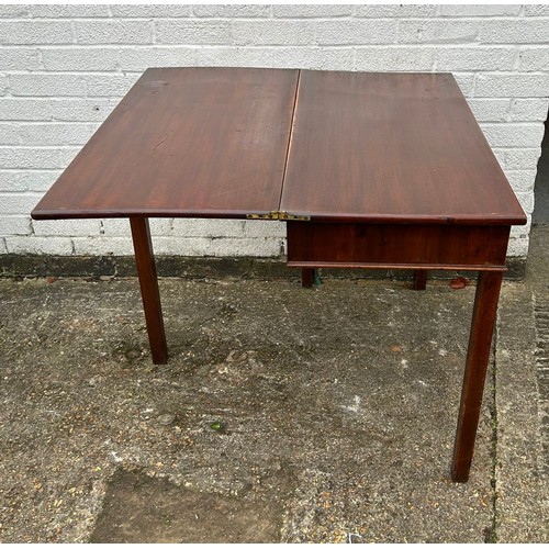 403 - A 19th Century mahogany fold over tea table, with single drawer, on square legs -