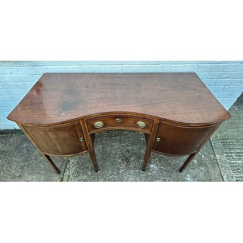 412 - A Georgian style mahogany serpentine fronted sideboard, including central drawers flanked by cupboar... 