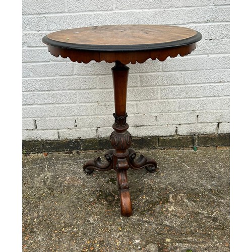 414 - A Victorian occasional table, with circular top over tapering column and three scrolled legs -