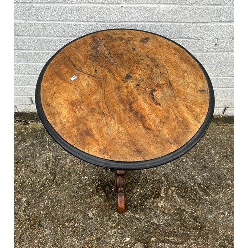 414 - A Victorian occasional table, with circular top over tapering column and three scrolled legs -