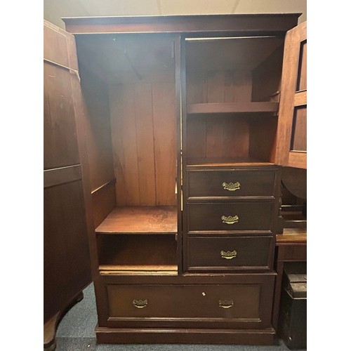 426 - An Edwardian wardrobe, with mirrored door, panelled door and three drawers all over base drawer -