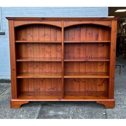 427 - A Ducal pine open bookcase, fitted with two rows of adjustable shelves -