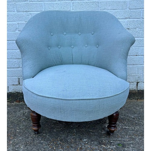 428 - A button back chair, on short turned legs and casters -