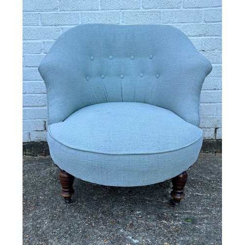 428 - A button back chair, on short turned legs and casters -