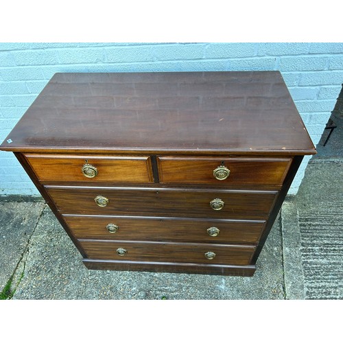 429 - An Edwardian walnut chest of drawers, fitted with two short and three long drawers -